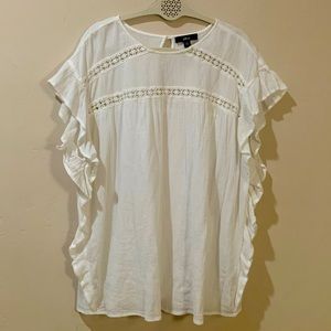 White ruffle blouse.